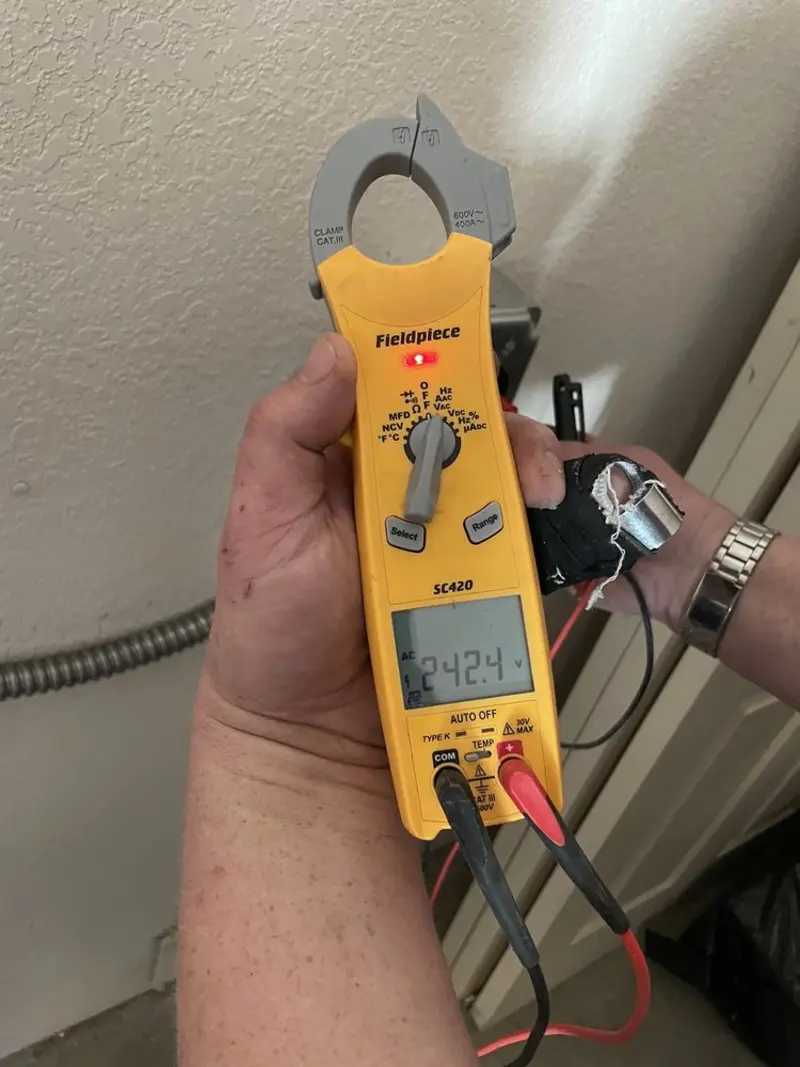 Voltage testing with clamp meter during Circuit Breaker Repair in Grosse Pointe Woods